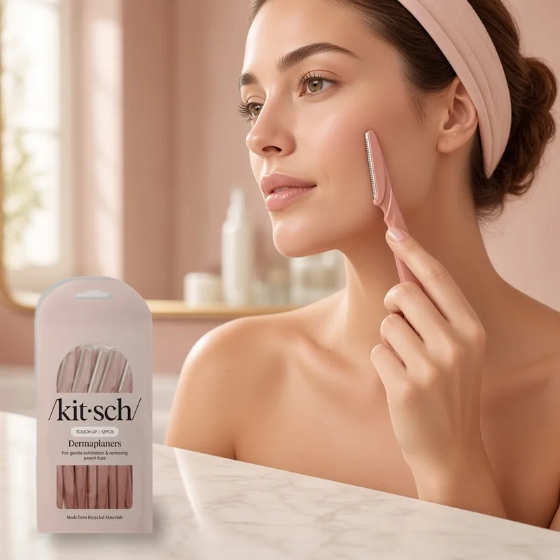 Illustration of a woman in a pink headband at a blush vanity gently gliding a terracotta dermaplaning razor along her cheek, with the real Kitsch terracotta Dermaplaners pouch on the marble counter.